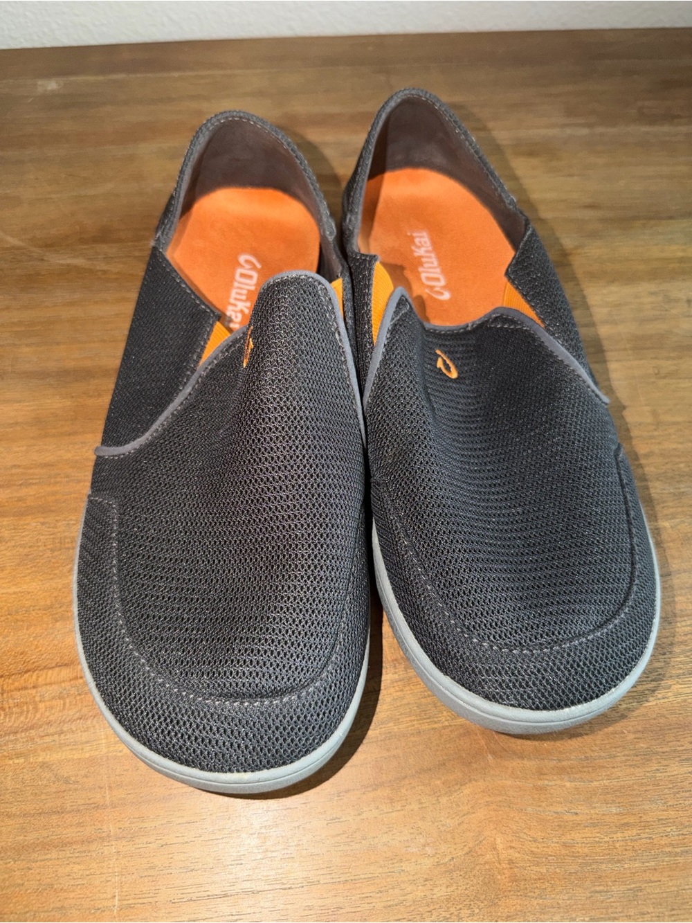 OluKai Black Slip-On Loafers with Orange Insole